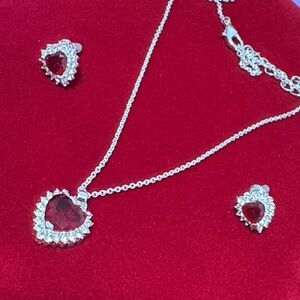 Lab grown red crystal heart silver- plated halo cubic zirconia stones.
